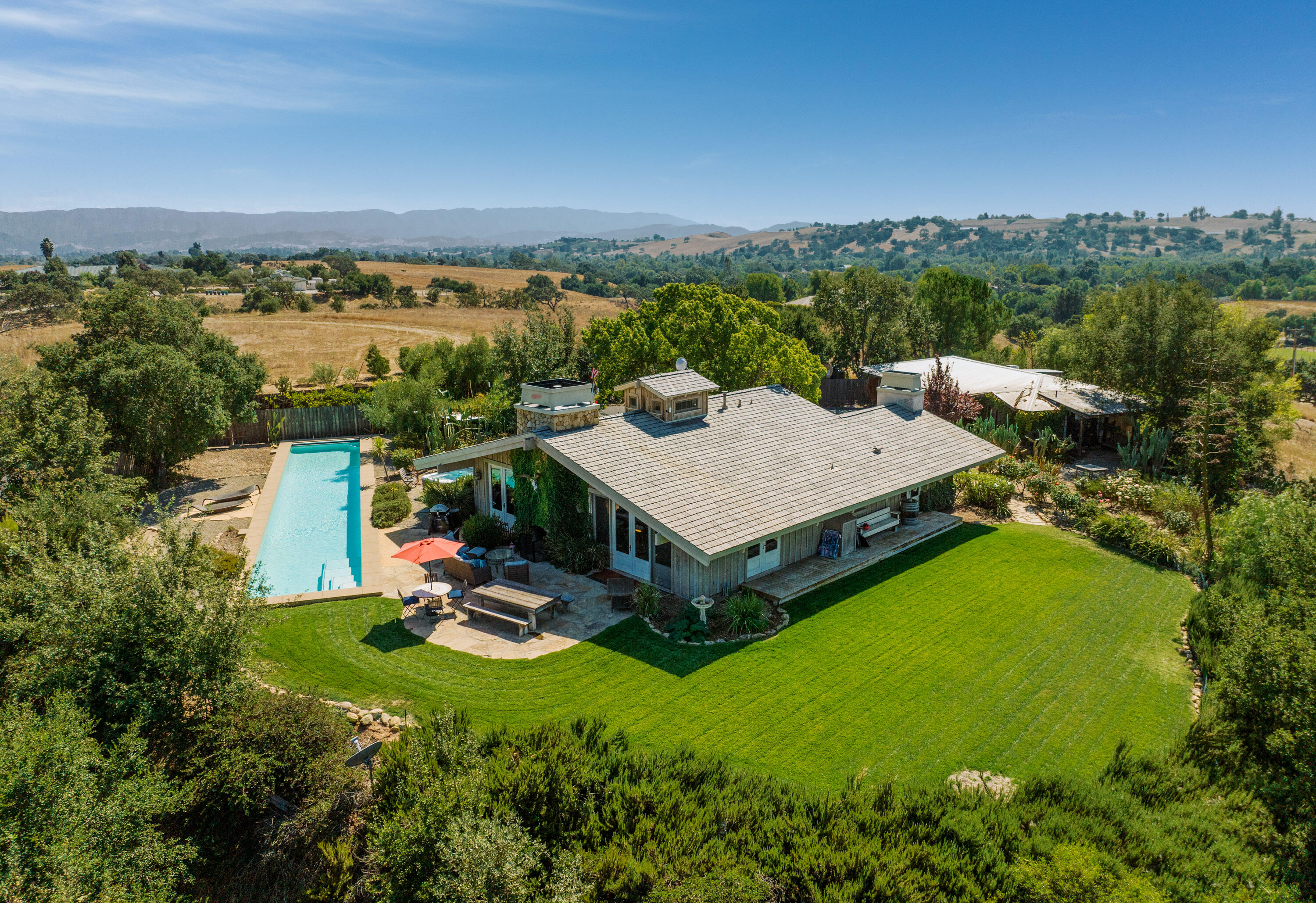 an aerial view of a house with a garden