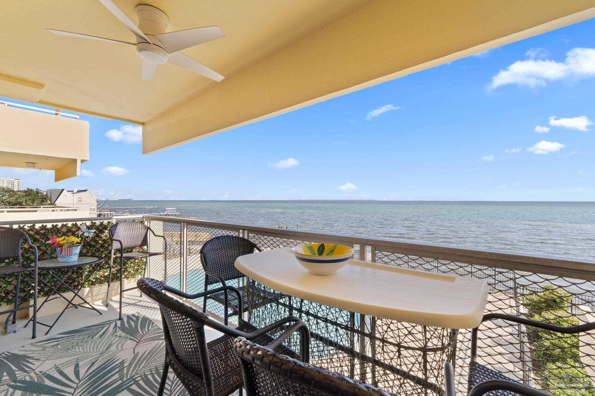 a view of an chairs and table in the patio