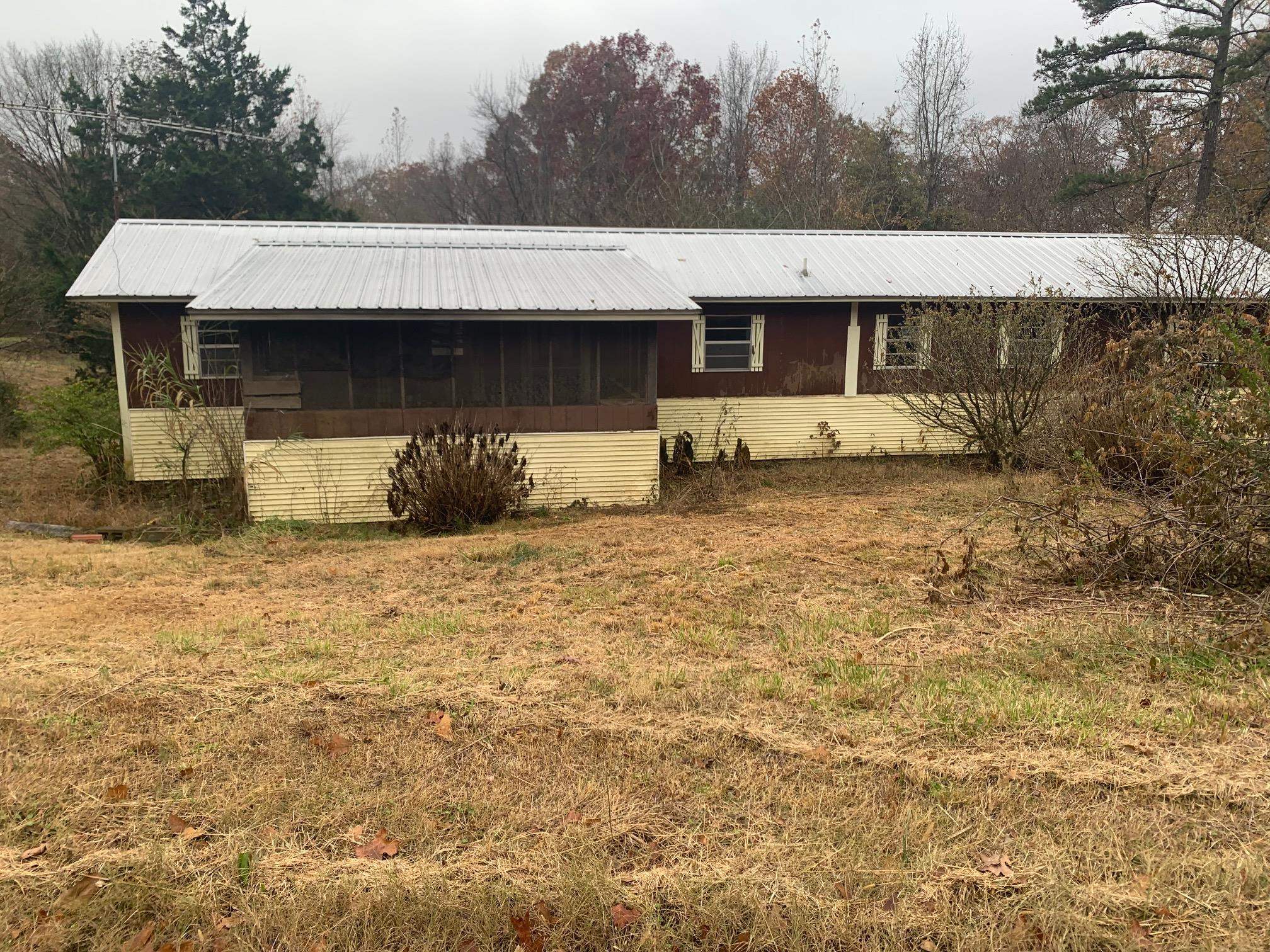 View of front of property with a sunroom