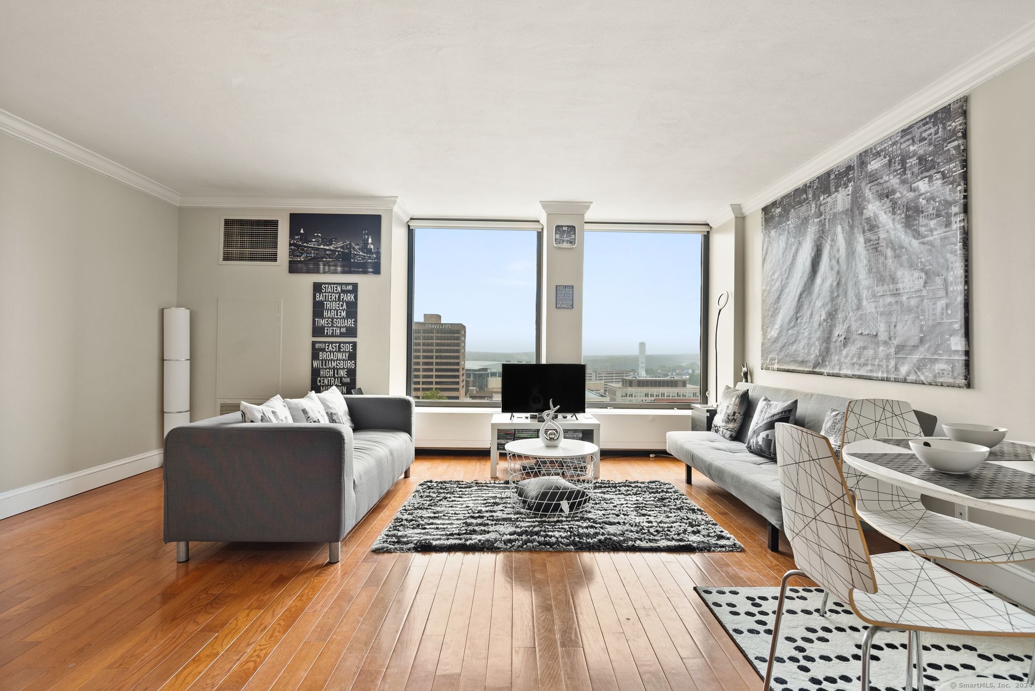 a living room with furniture and large windows