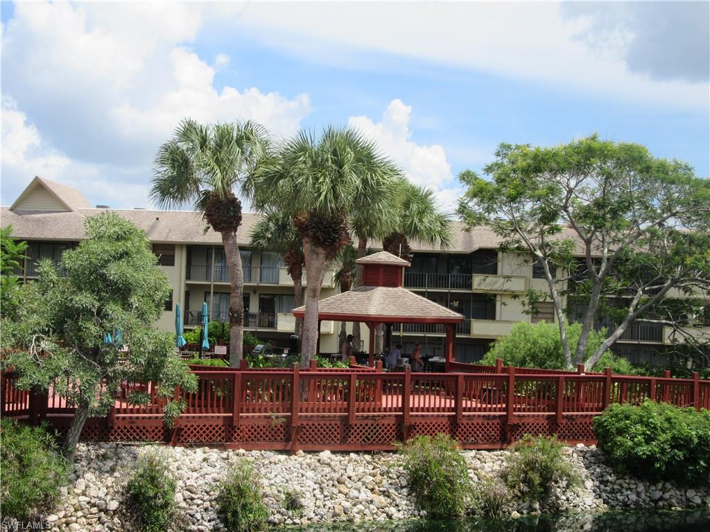 a front view of a house with yard and outdoor seating