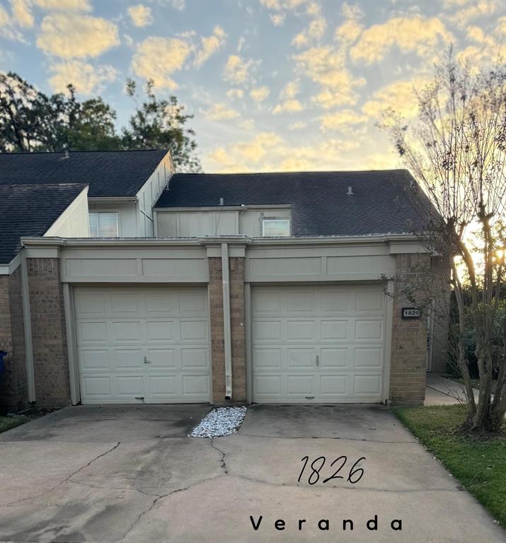 a front view of a house with a garage