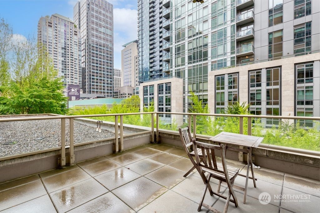 a view of a balcony with chairs