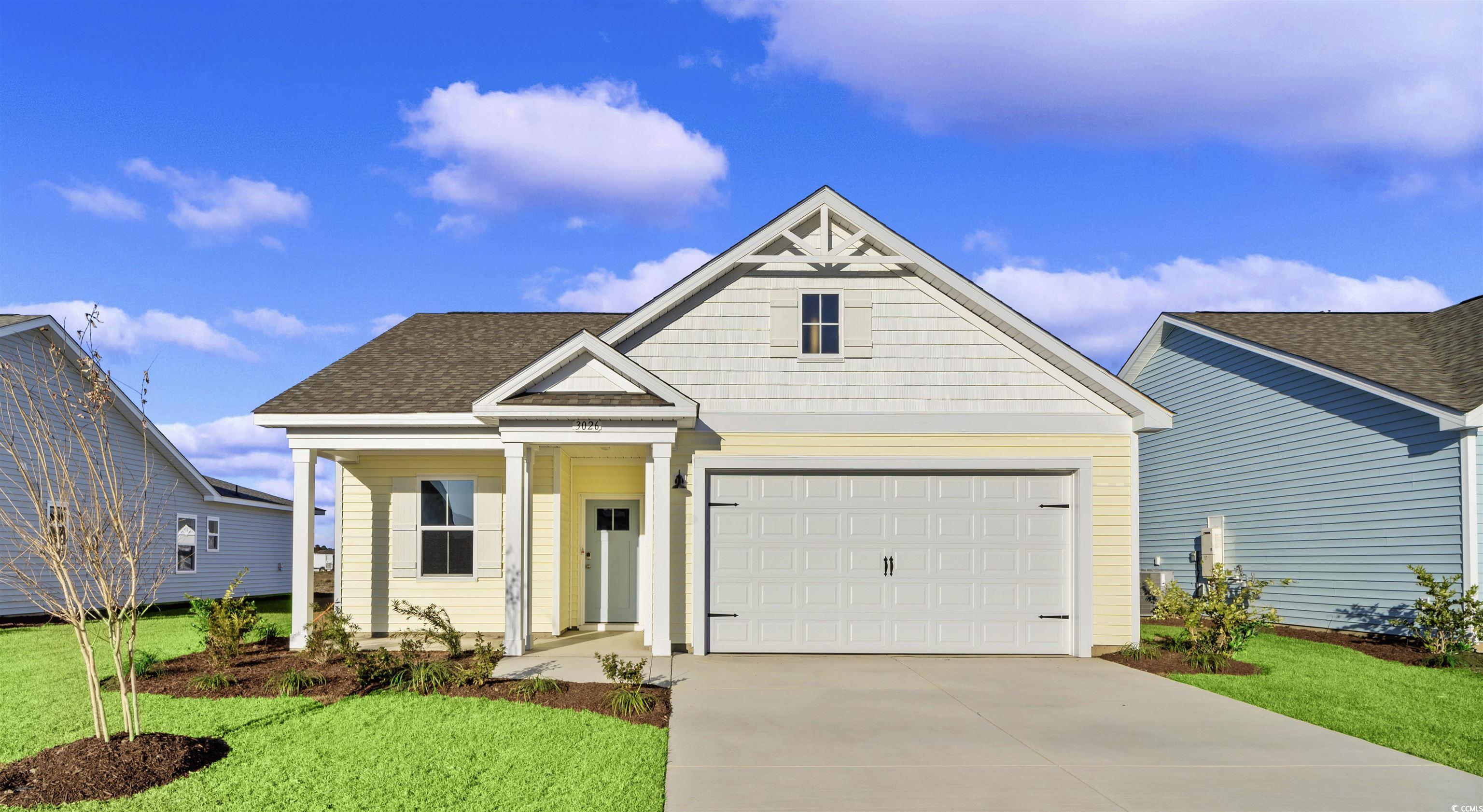 View of front of home featuring a front yard and c