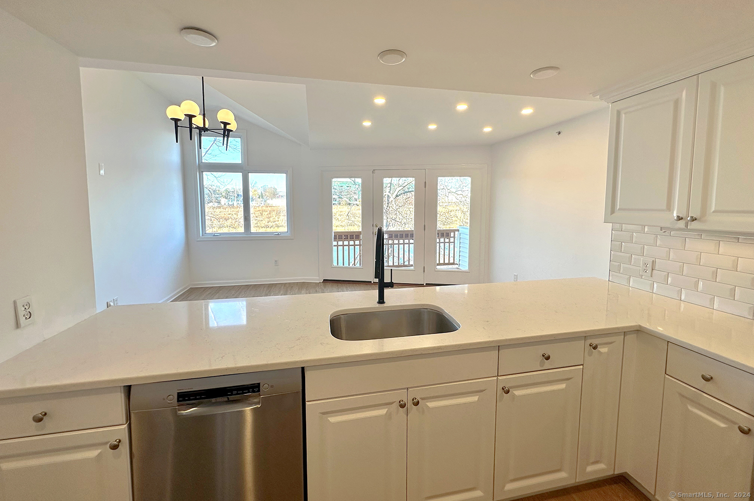 a kitchen with a sink and cabinets