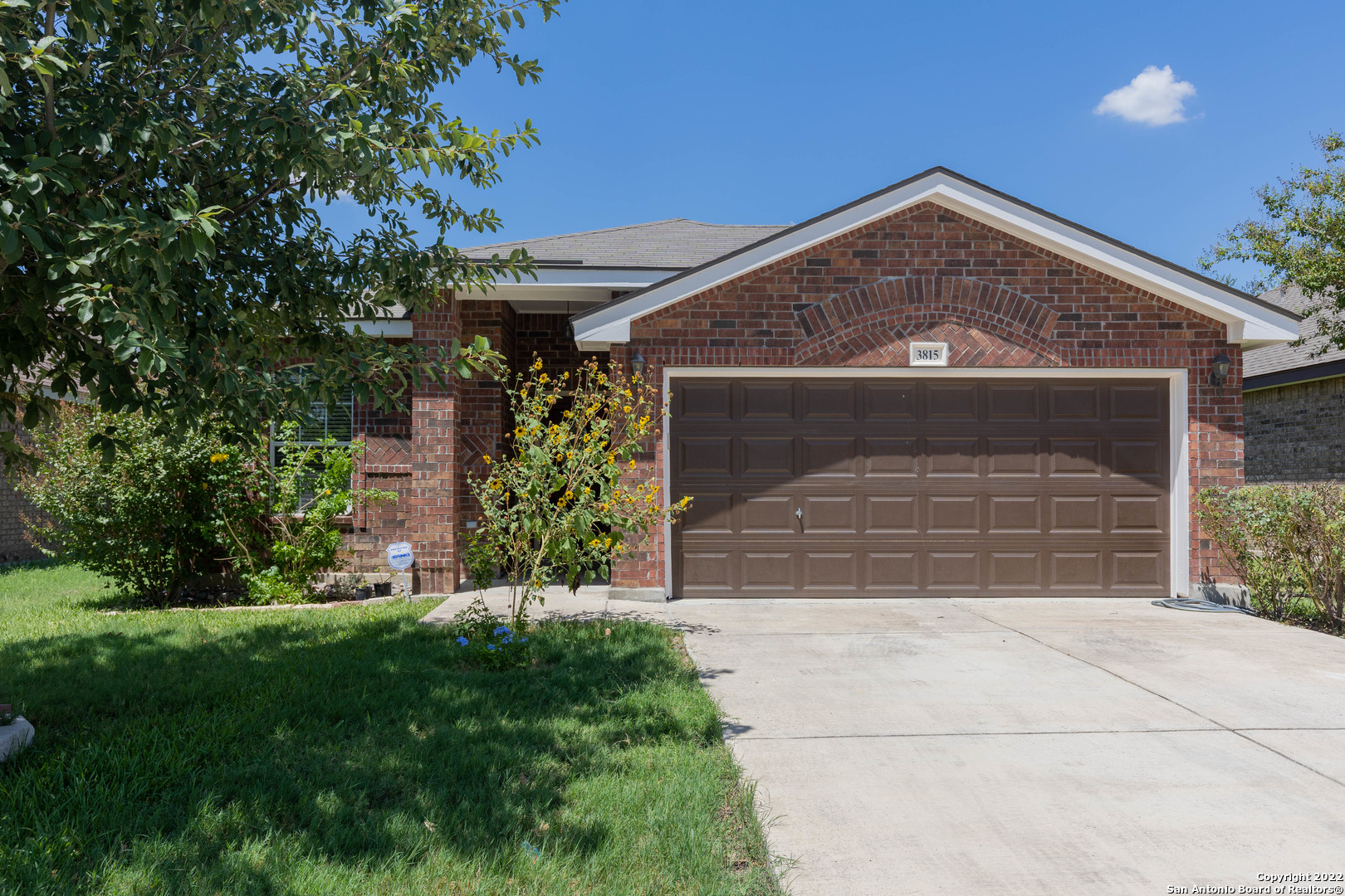 front view of a house with a yard