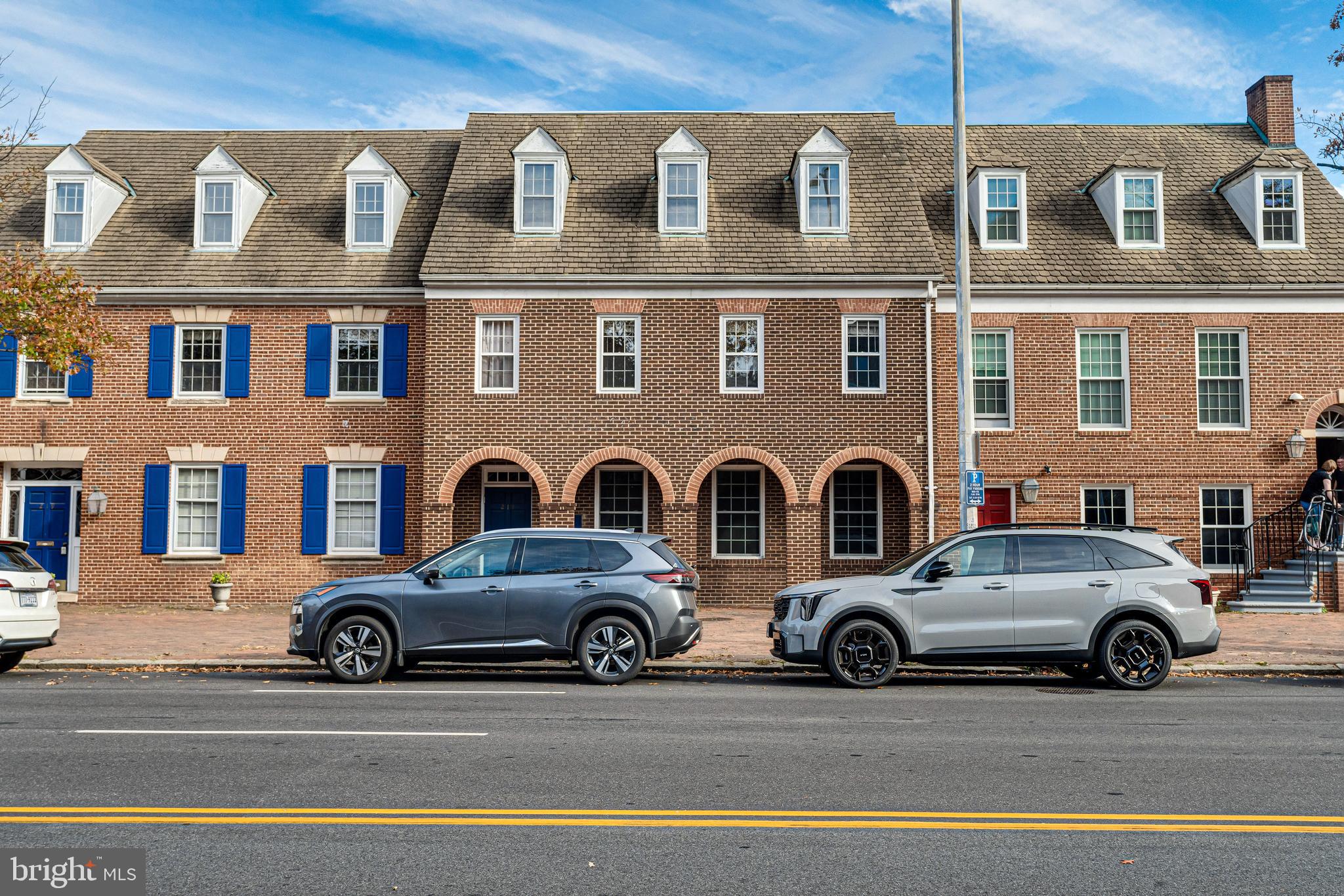 a view of a car parked in front of a building