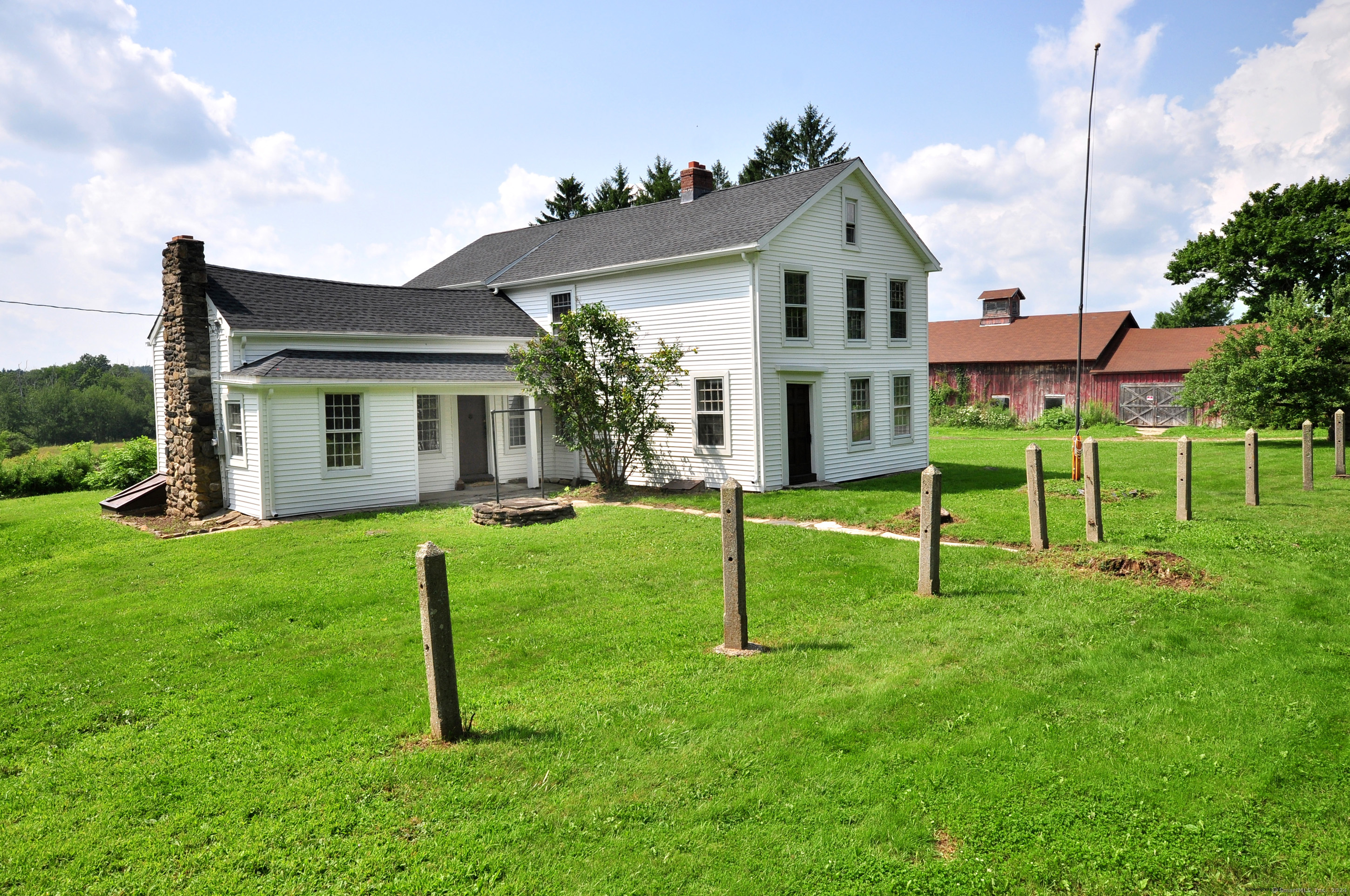 a front view of house with a garden