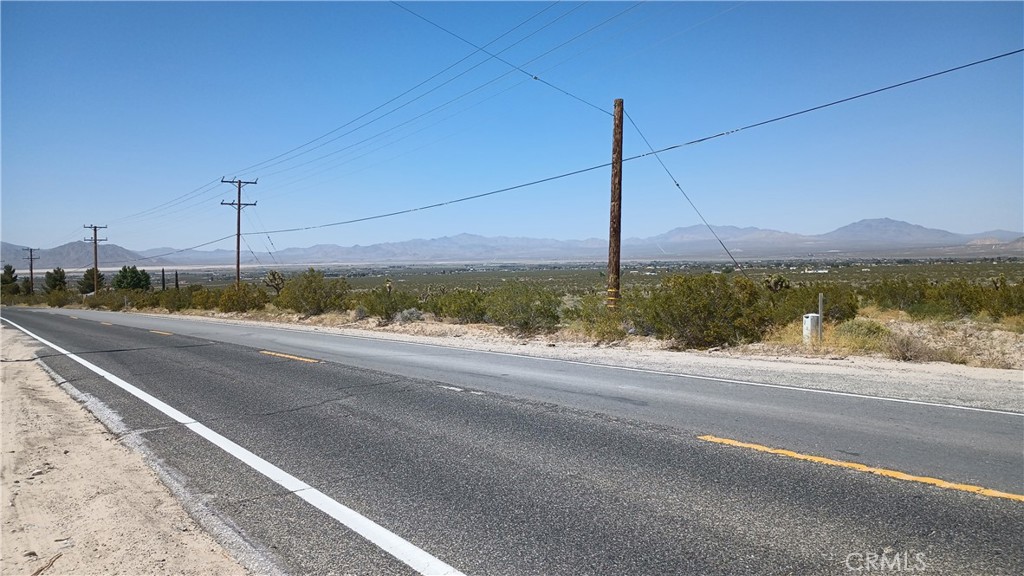 a view of a road with a ocean view