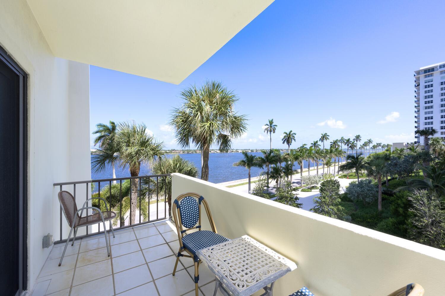 a view of a chairs and table in a balcony