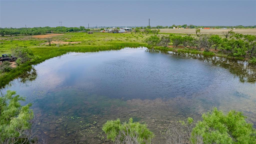 a view of a lake with a big yard