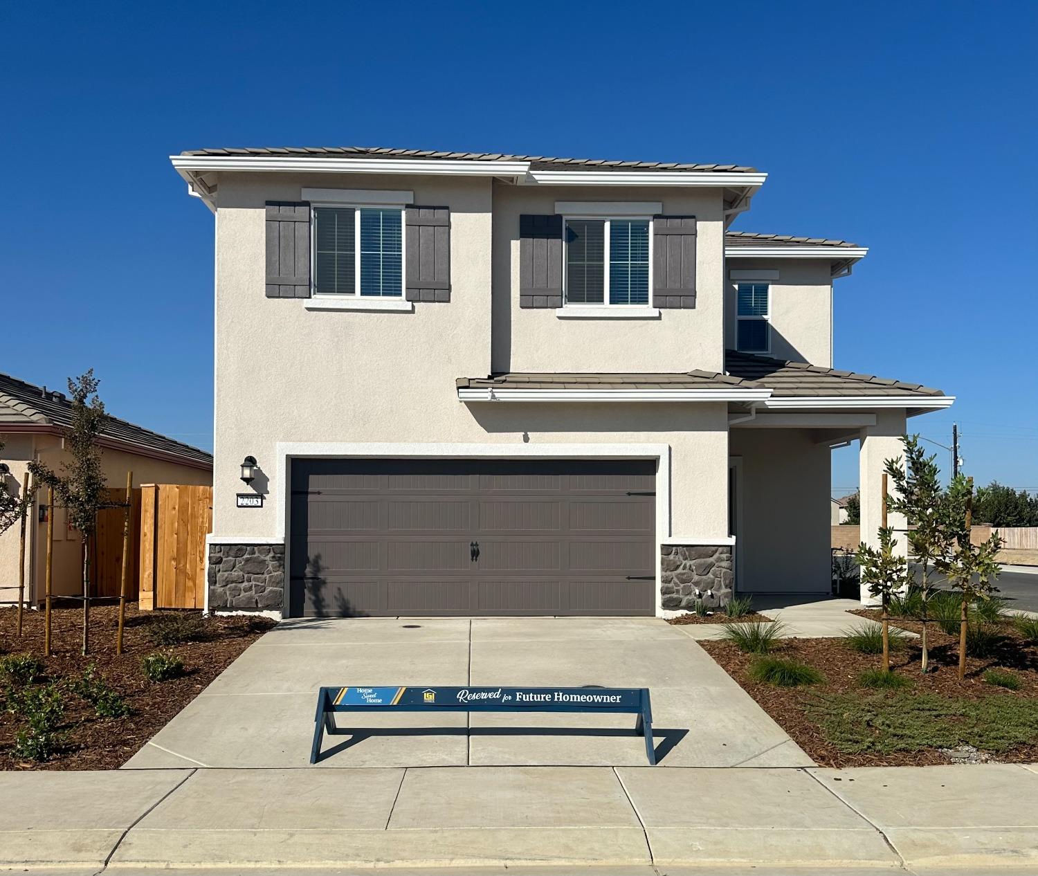 a front view of a house with garage