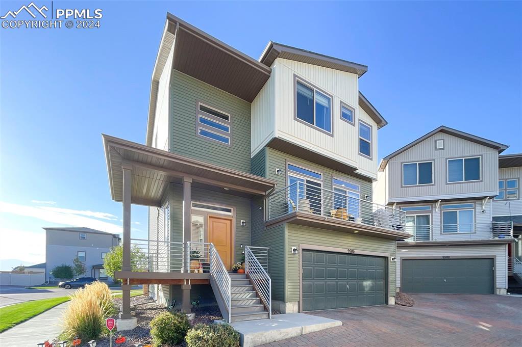 a front view of a house with garage