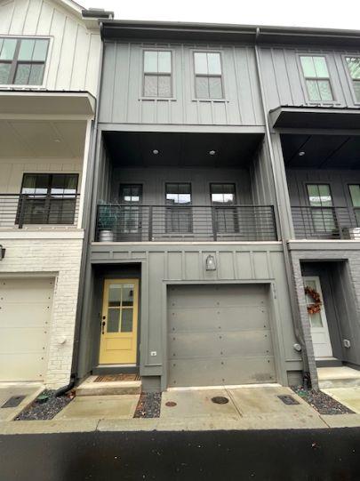 a view of building with car parked