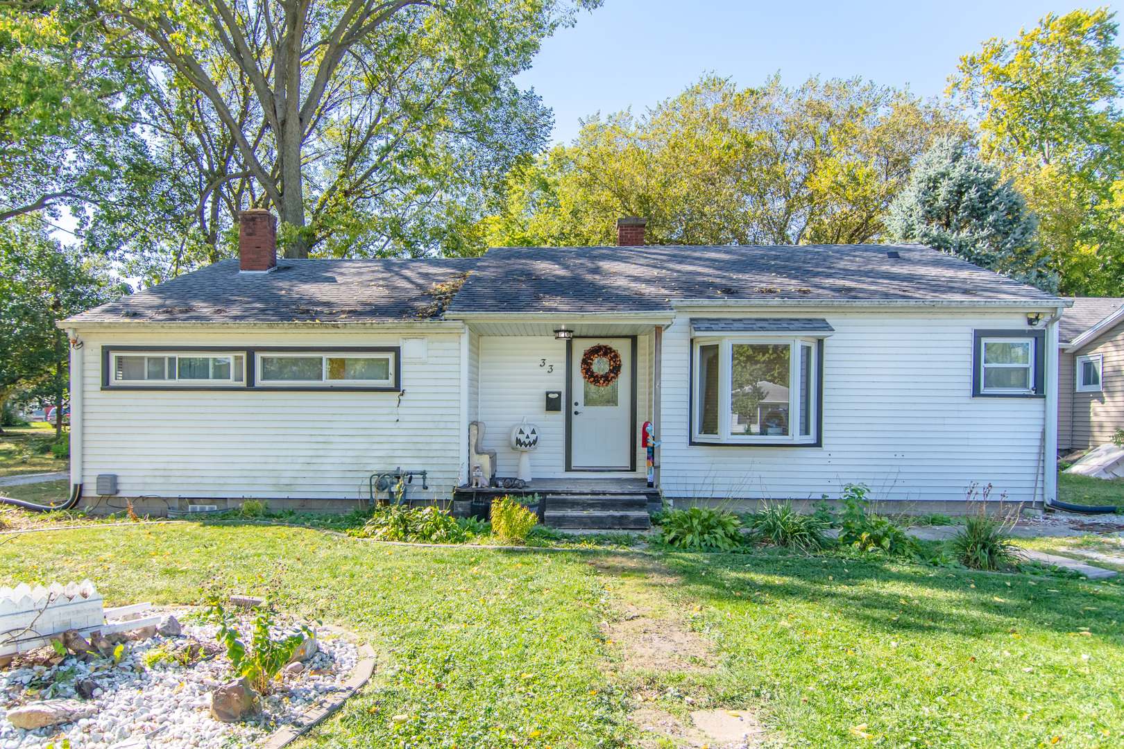 a house with trees in the background