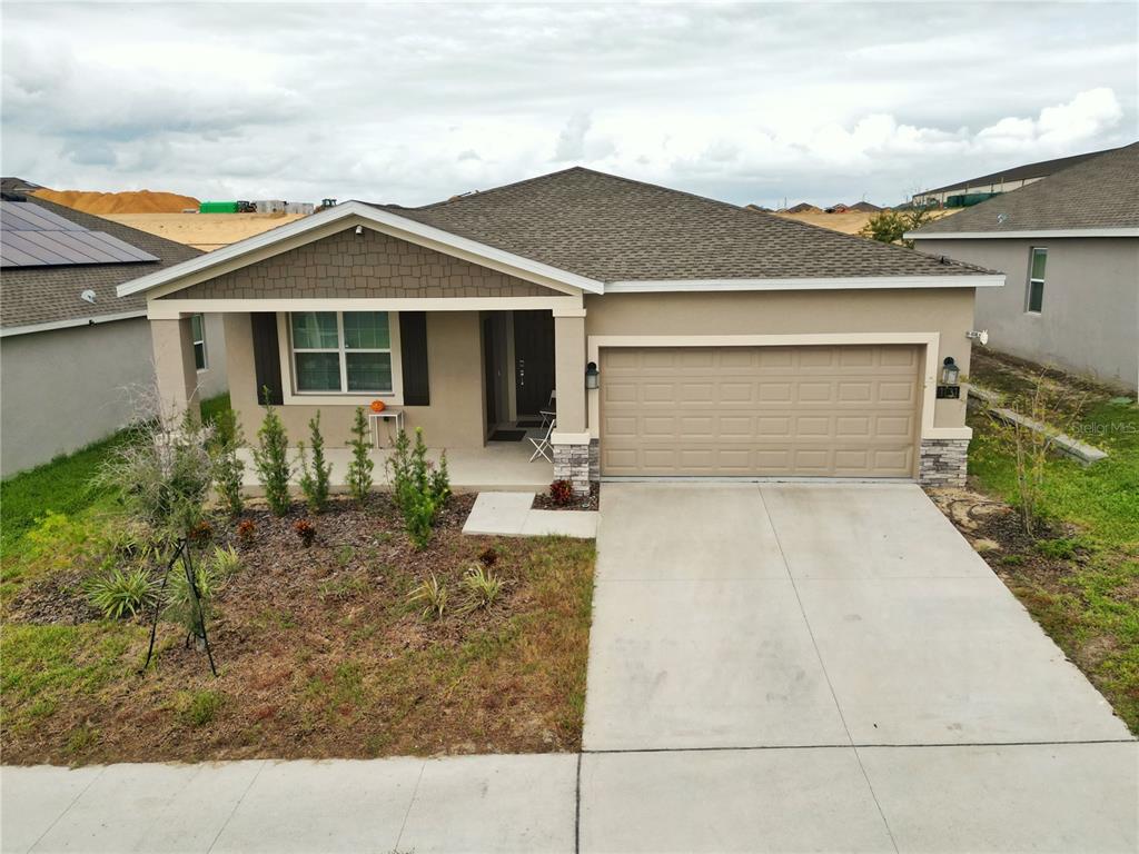 front view of a house with a yard