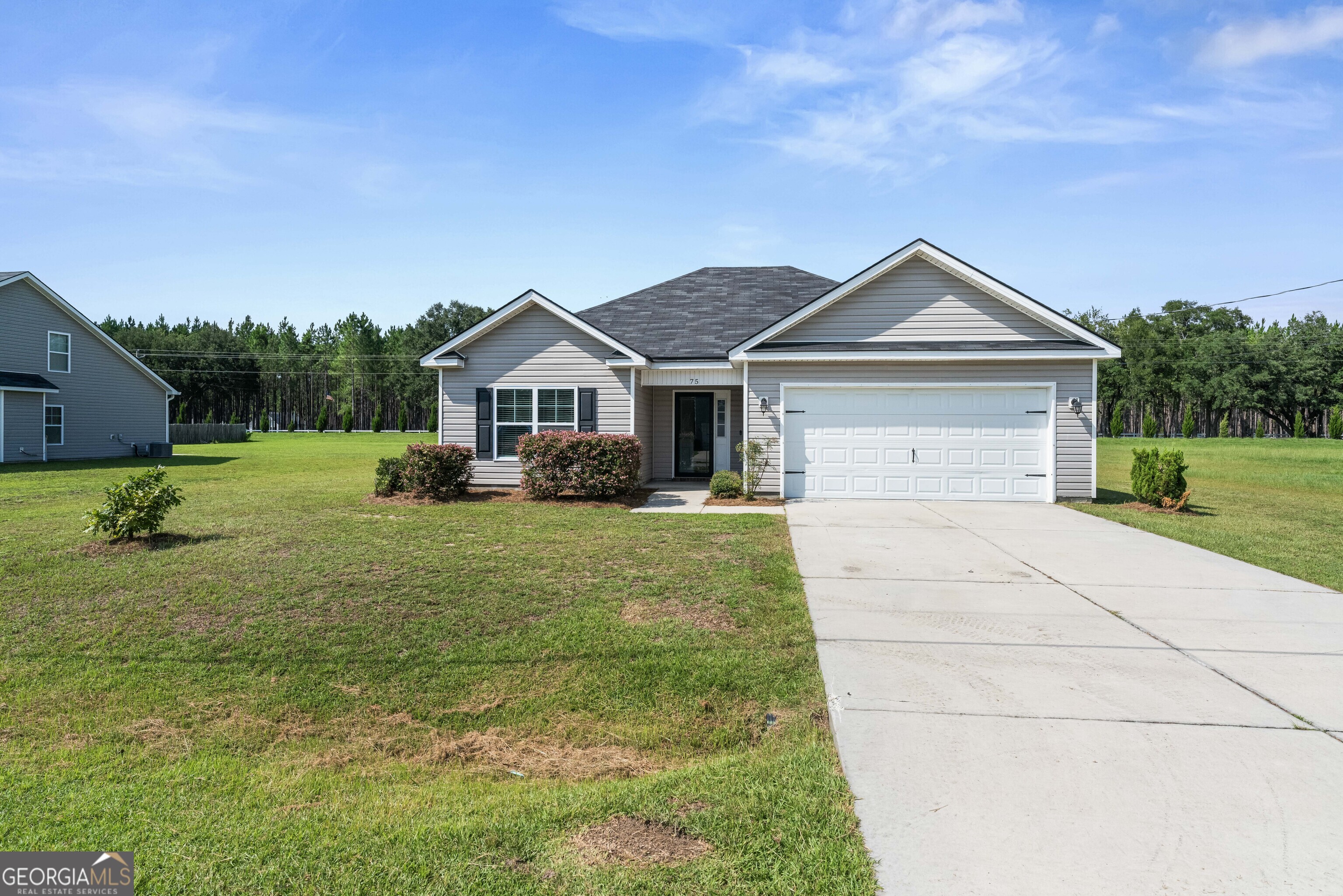 a front view of a house with a yard