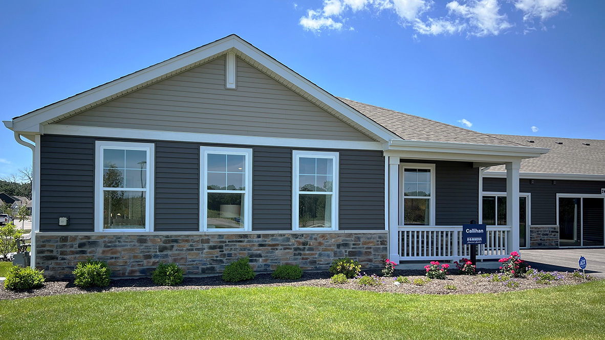 a view of house with yard