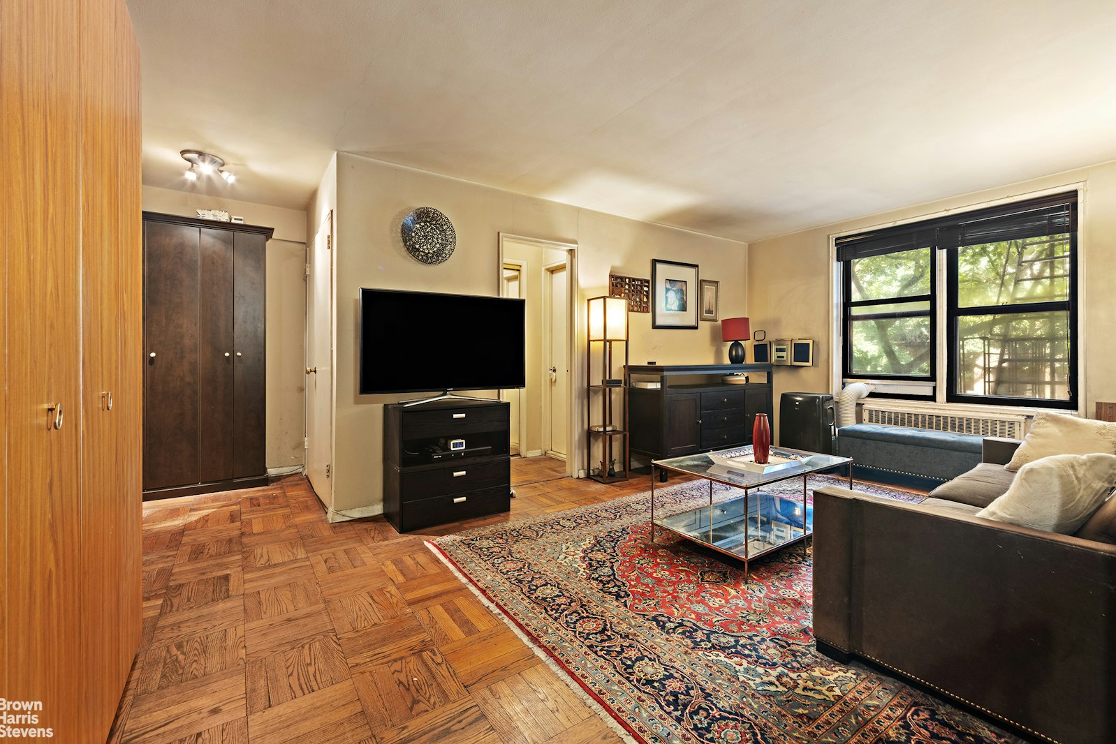 a living room with furniture and a flat screen tv