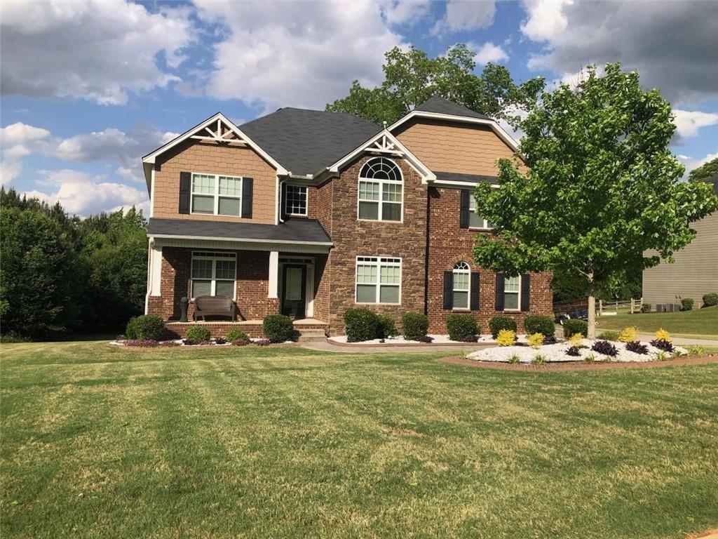 front view of a house with a yard