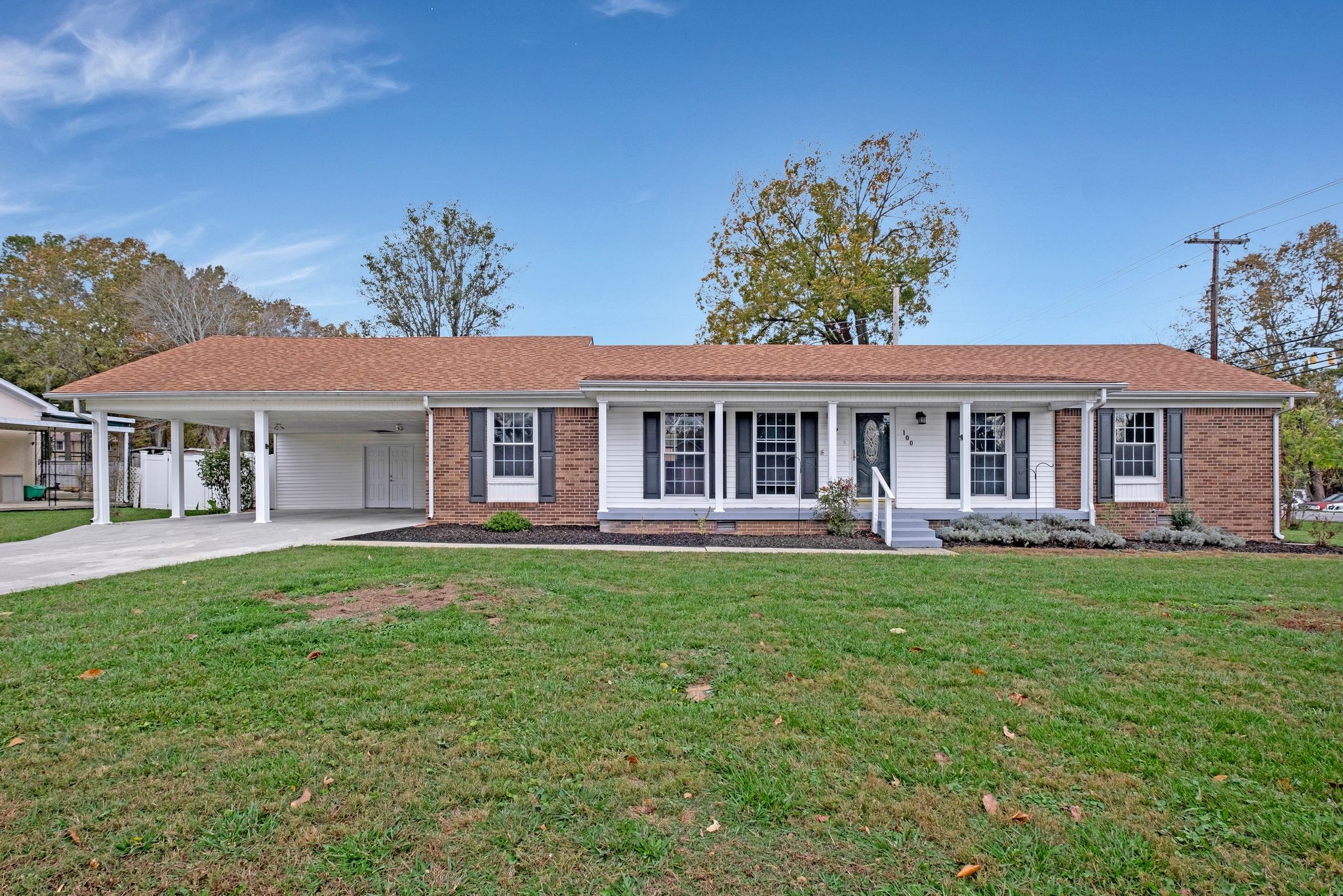 front view of a house with a garden