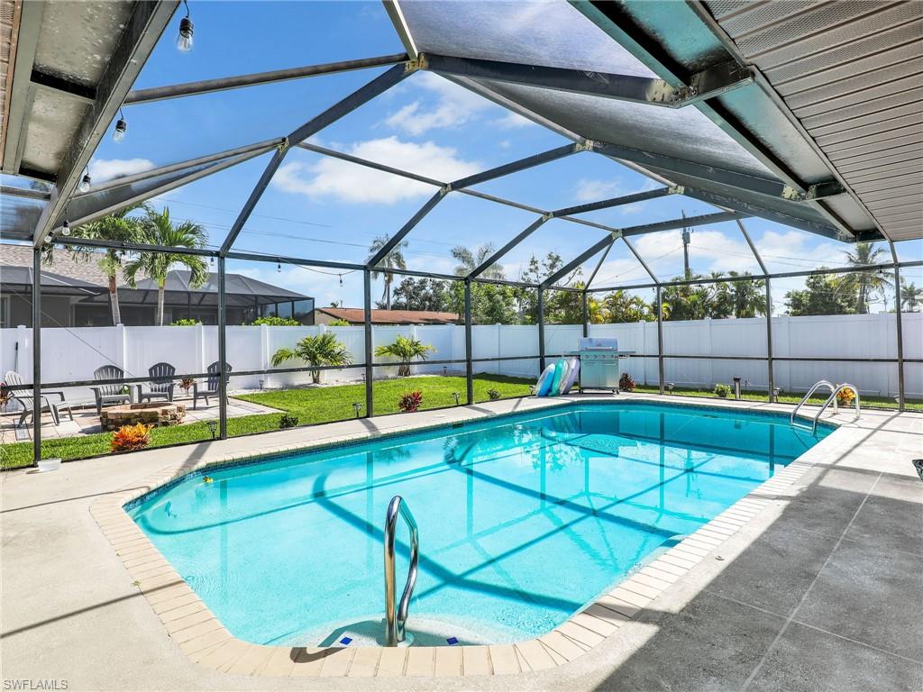 a view of a swimming pool with a patio