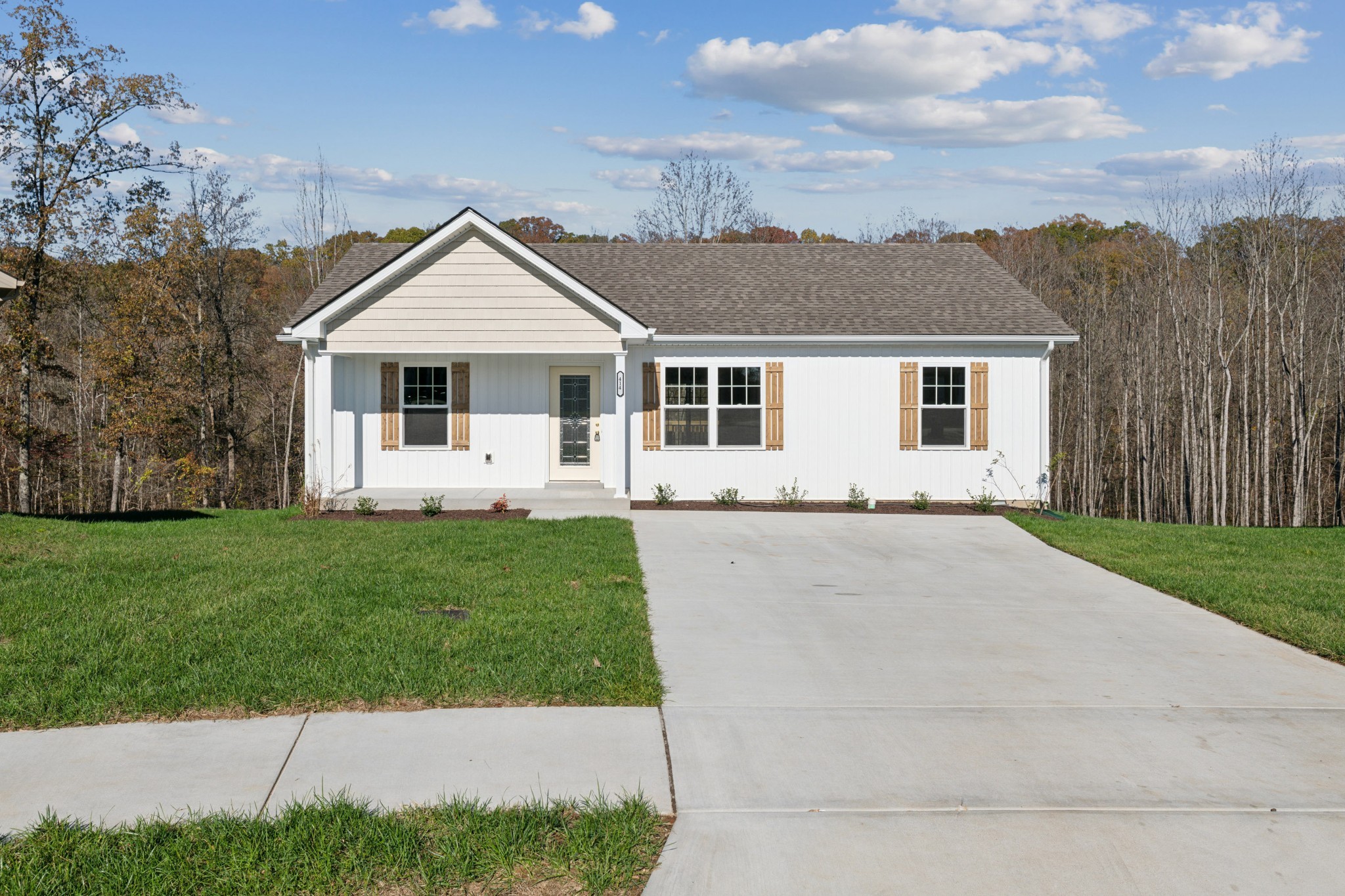 front view of a house with a yard