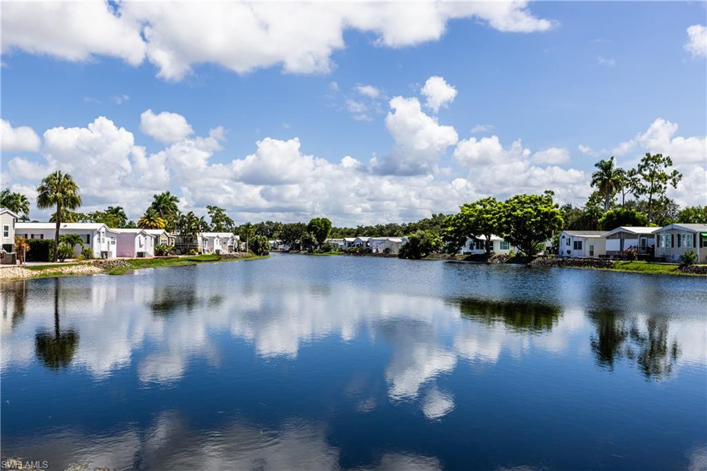 a view of swimming pool next to a lake view