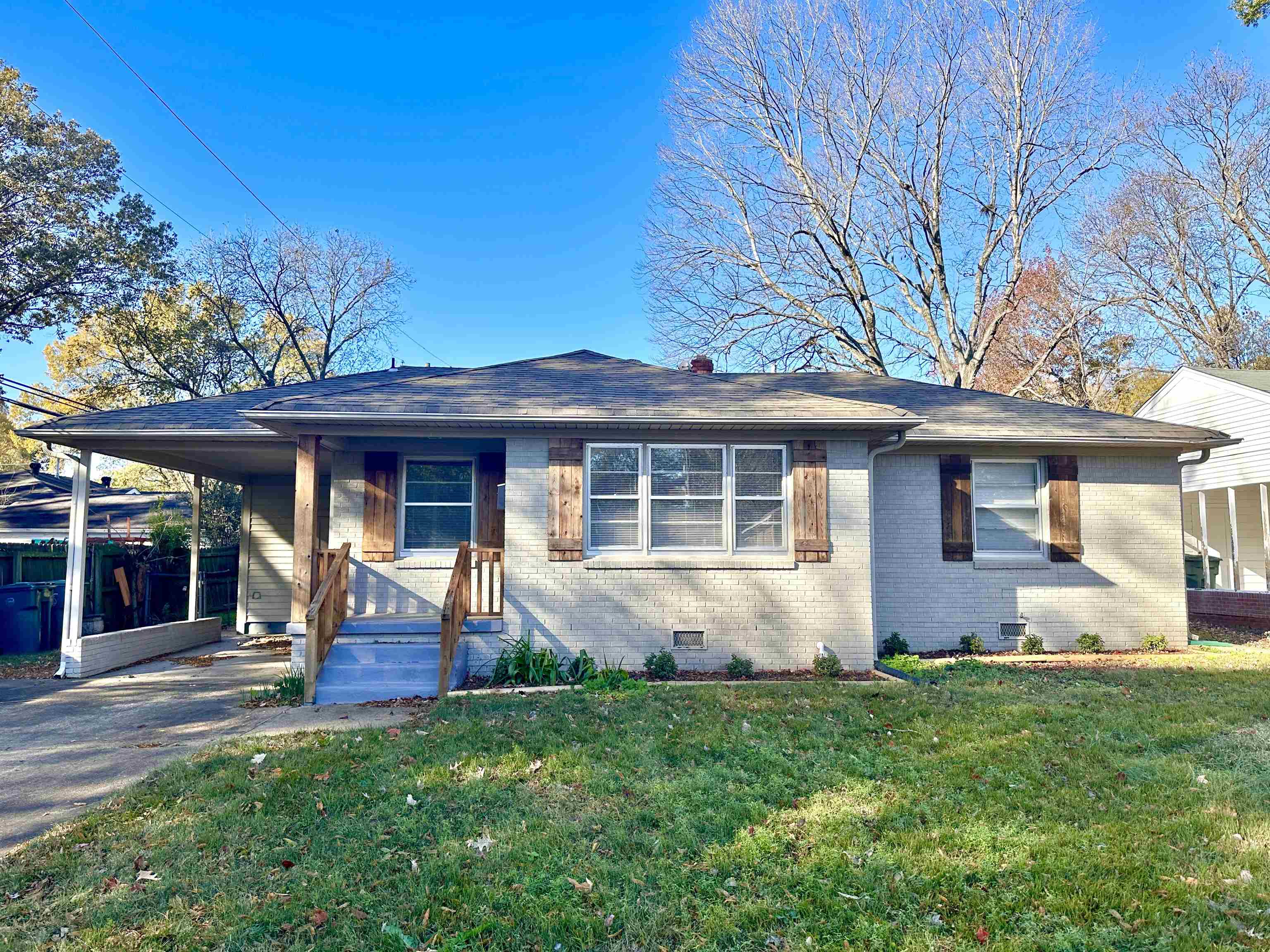 front view of a house with a yard