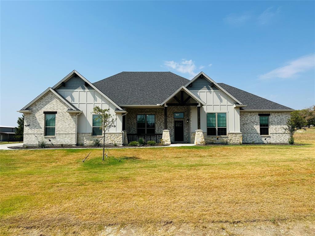 a front view of a house with swimming pool