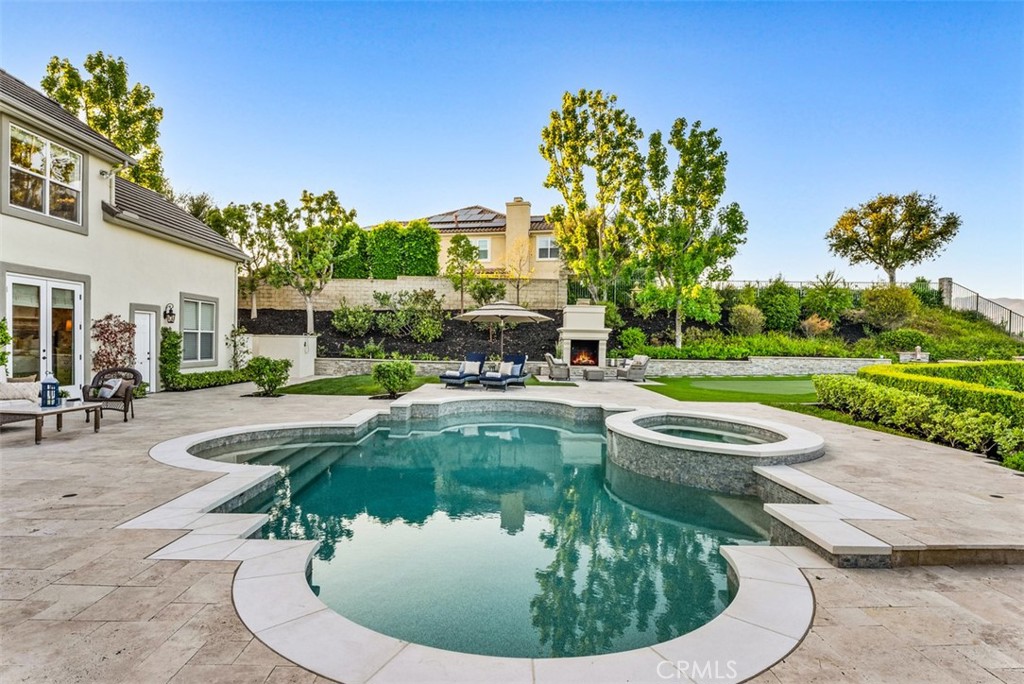 a view of a swimming pool with a patio