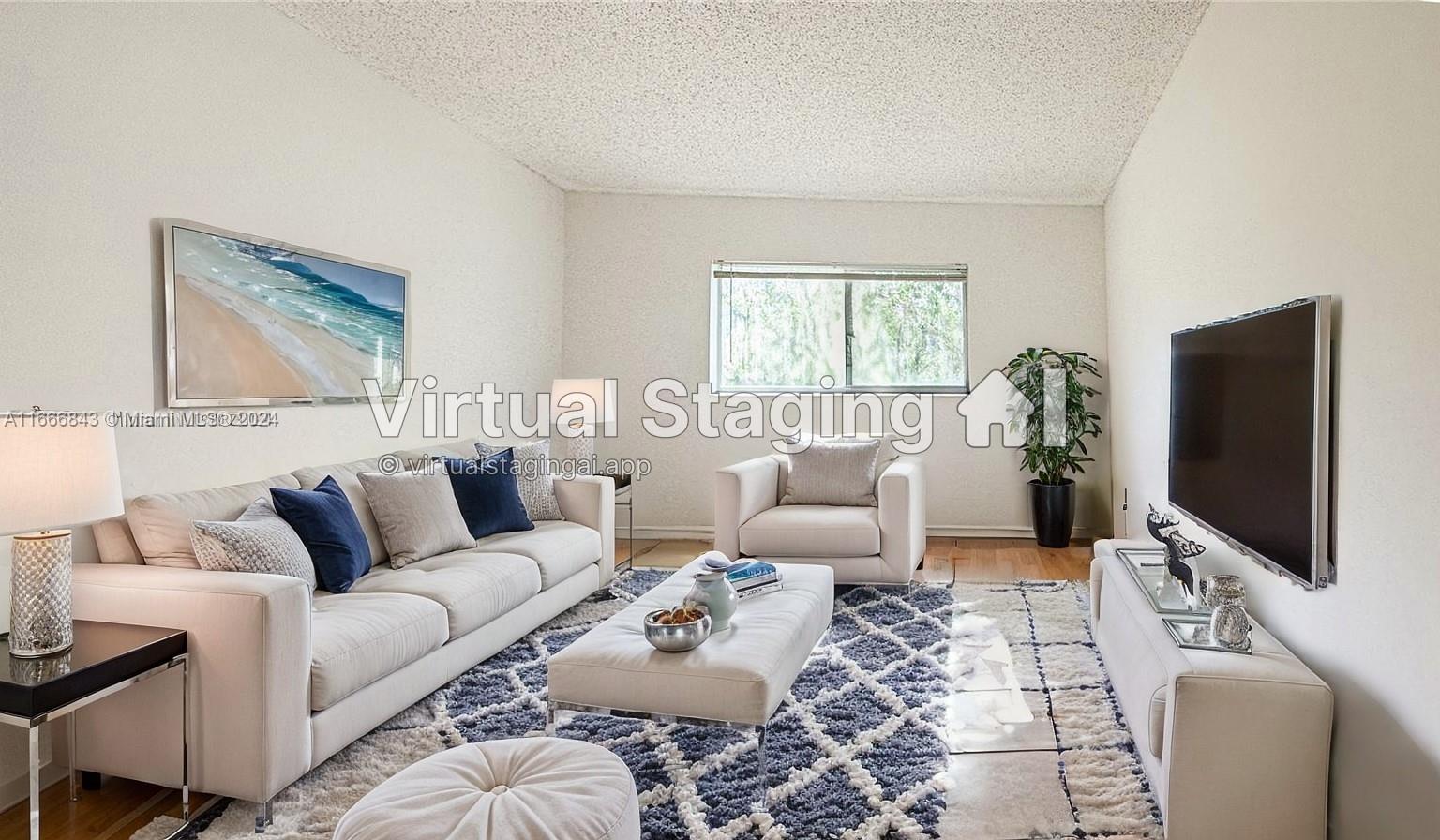 a living room with furniture a flat screen tv and a window