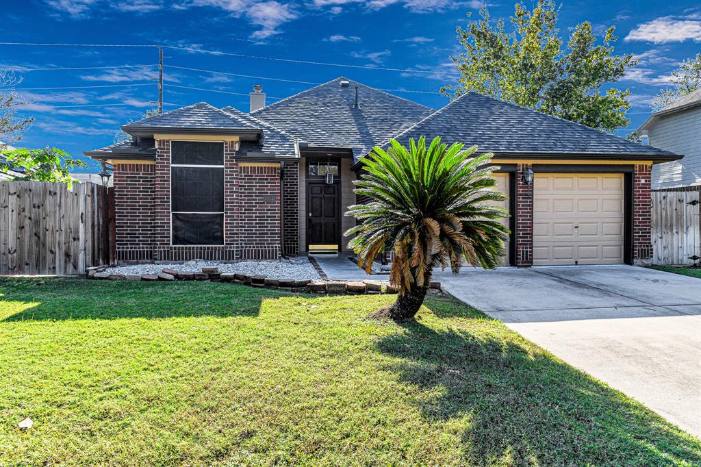 a front view of house with yard and seating area