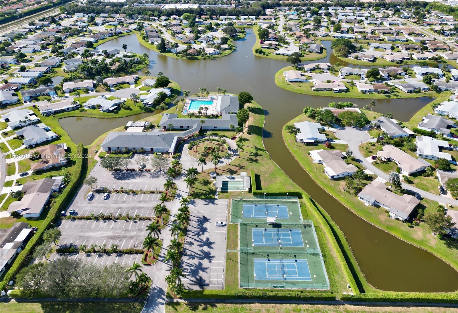 an aerial view of a residential houses with outdoor space