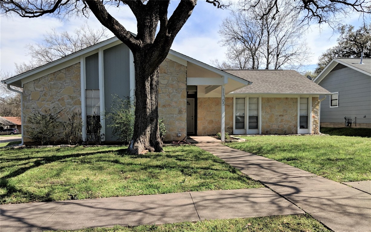 front view of a house with a yard