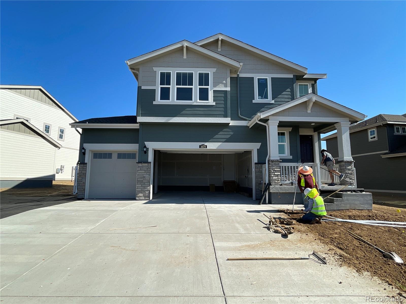 a front view of a house with garage