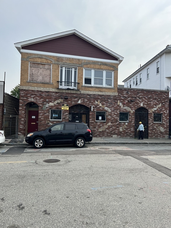 a car parked in front of a house