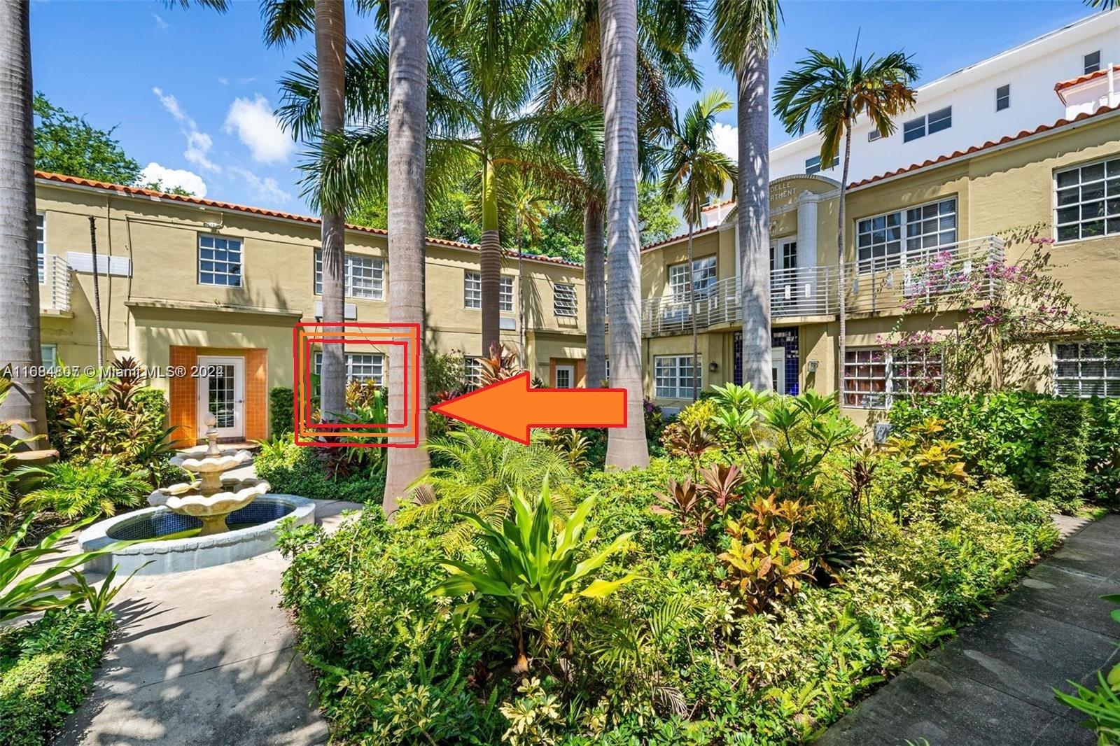 front view of a house with a garden