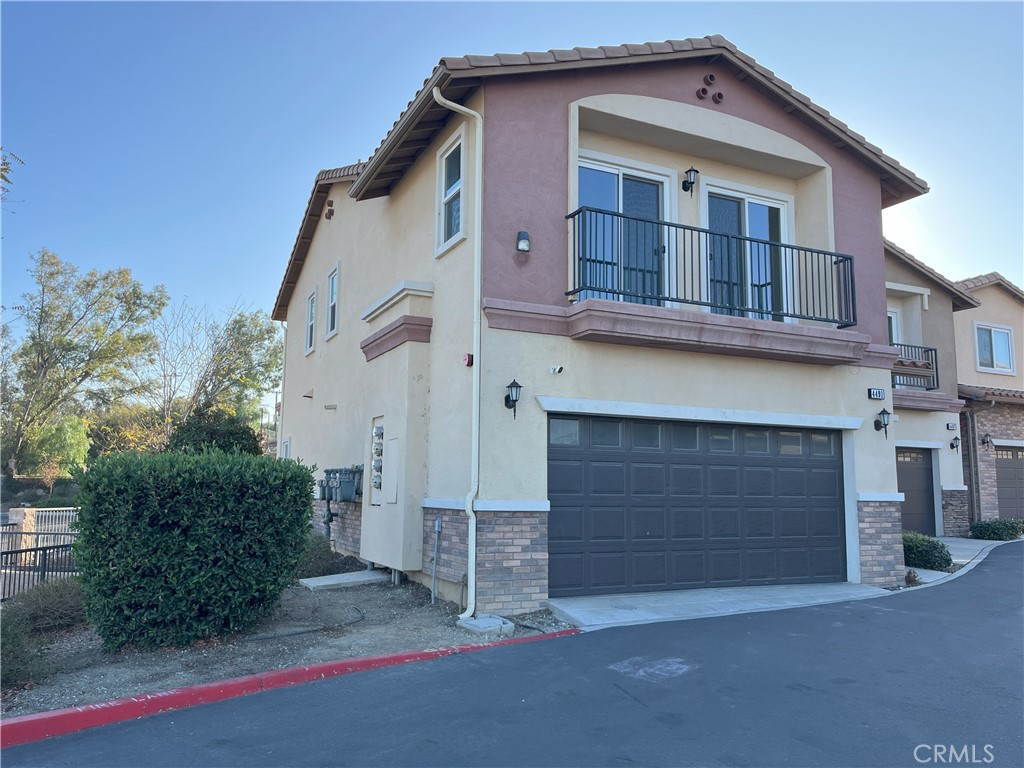 a front view of a house with a garage