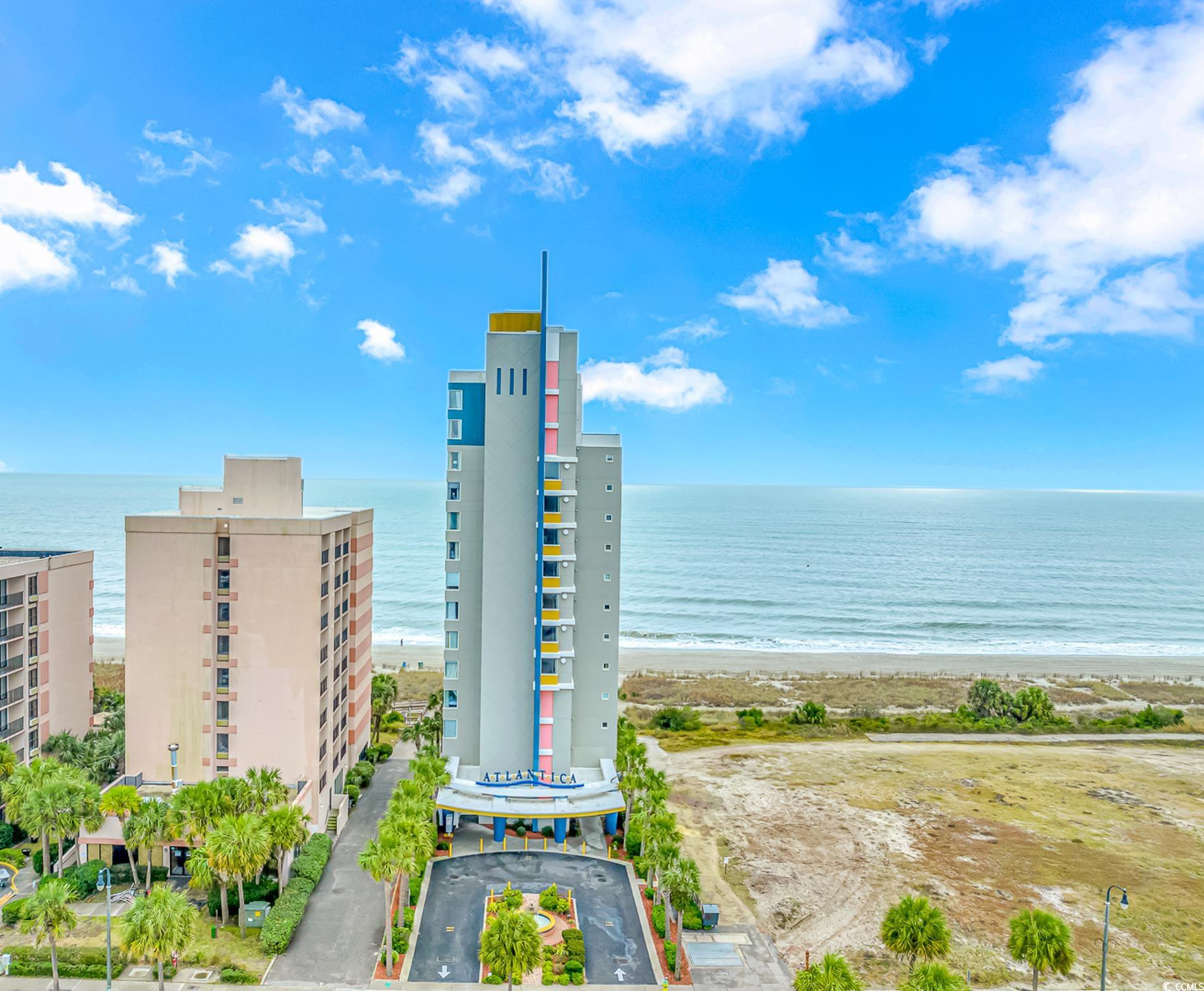 View of building exterior with a water view and a