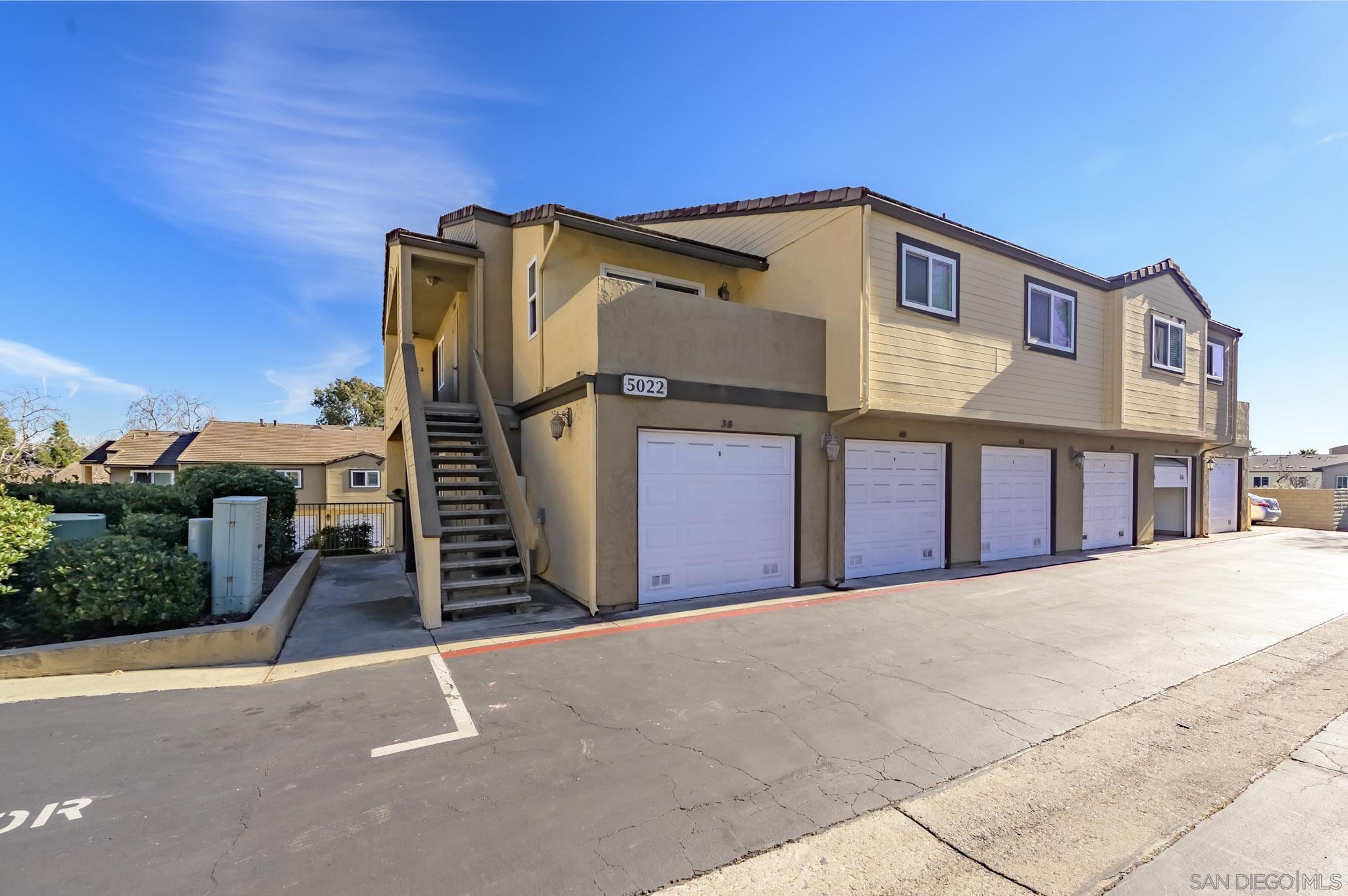 a front view of a house with a garage