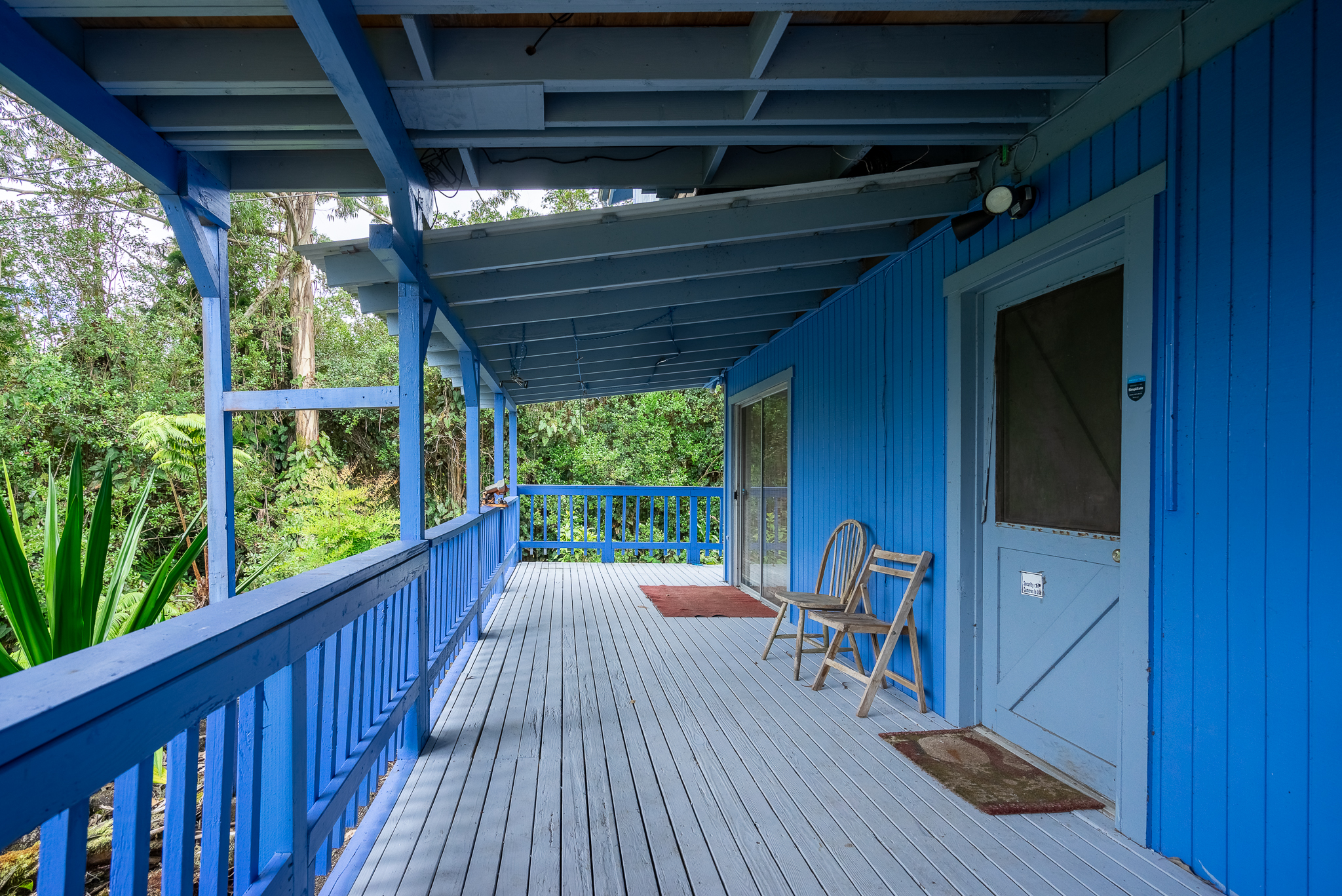 a view of a two chairs in the balcony