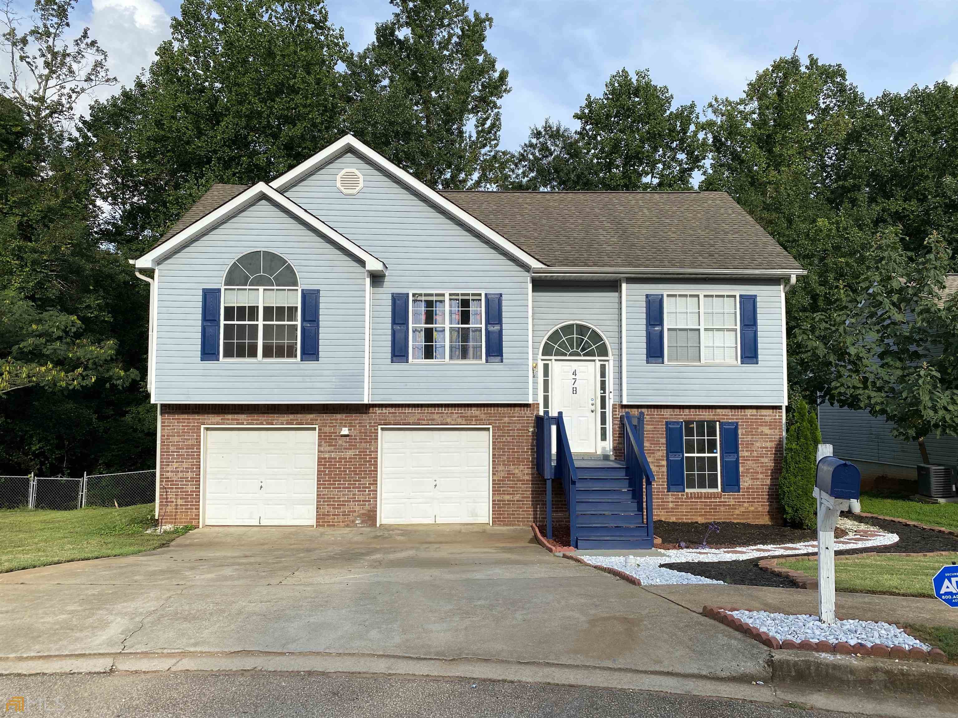 a front view of a house with a garage