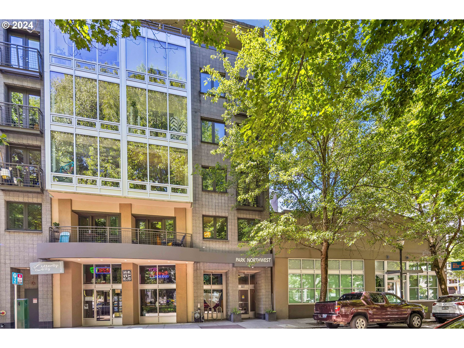 a view of a building with a tree