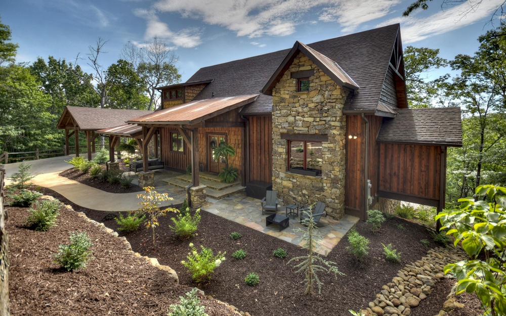 a front view of a house with garden