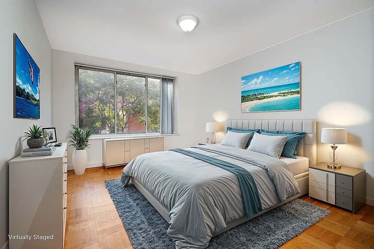 a bedroom with a large bed and a balcony