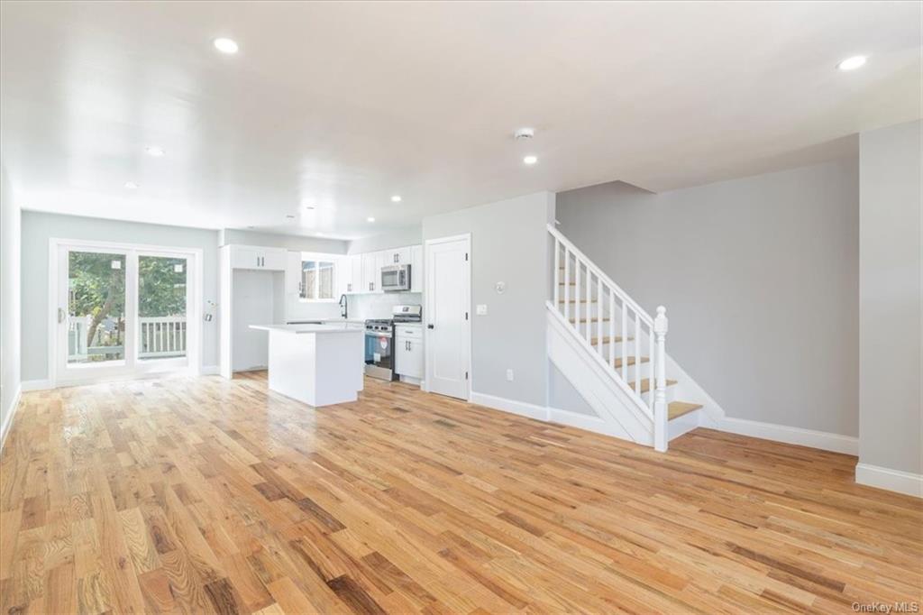 Unfurnished living room with light wood-type flooring