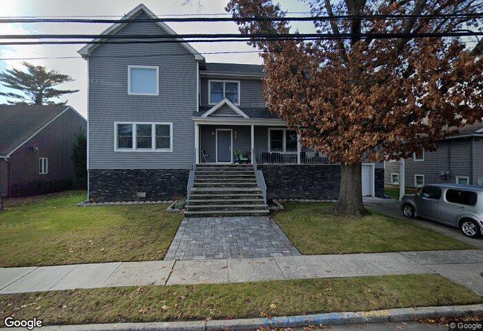 View of front of house with a front lawn and covered porch