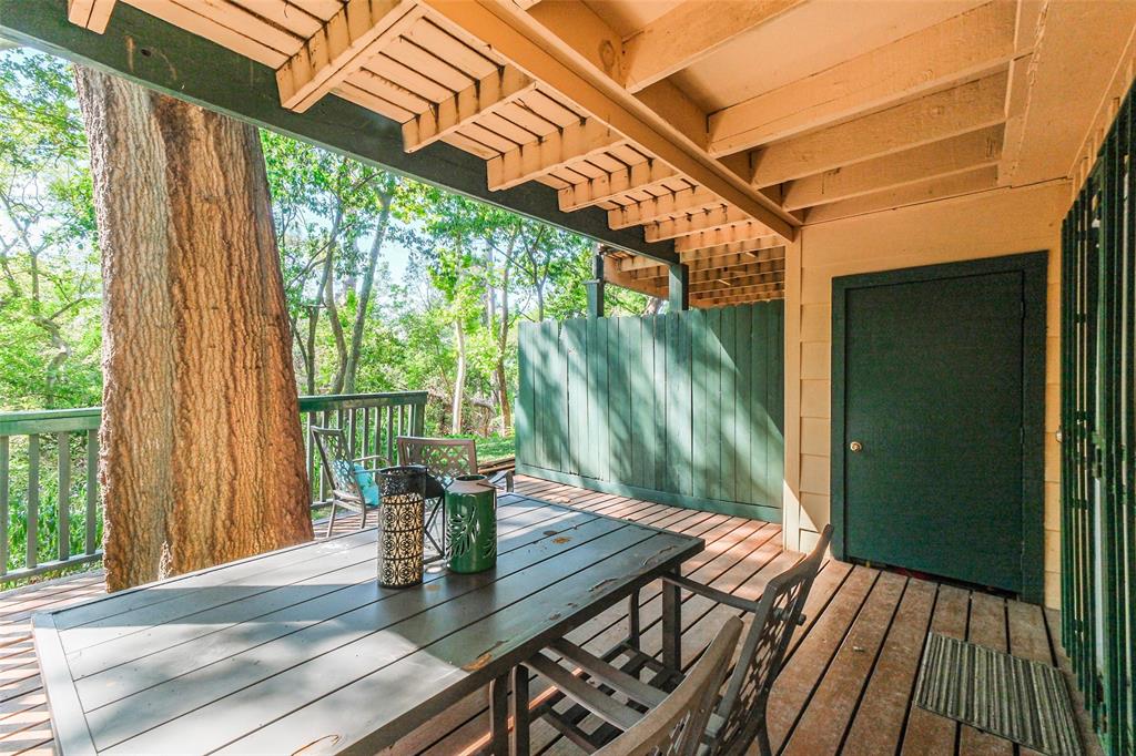 Wonderful shady spot for your morning coffee! Also pictured here is a storage space.