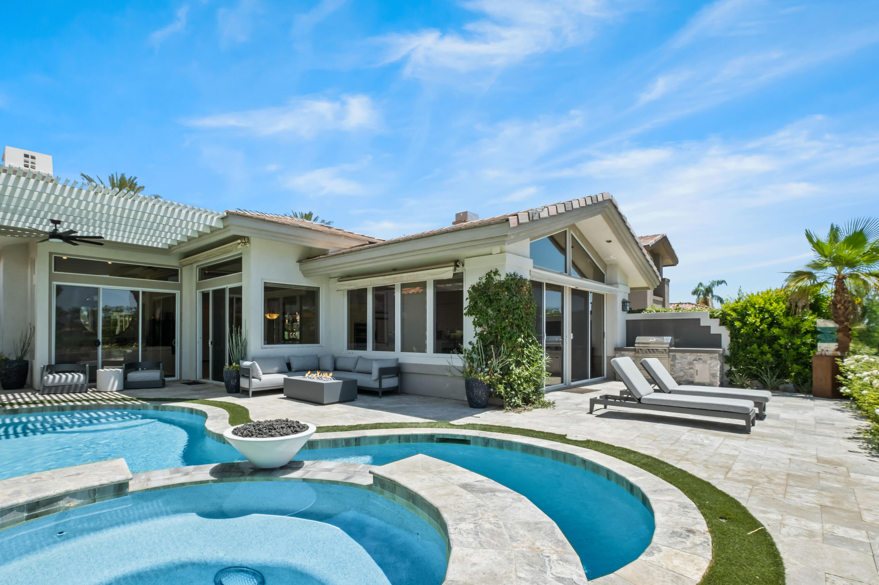 a view of a house with swimming pool and porch